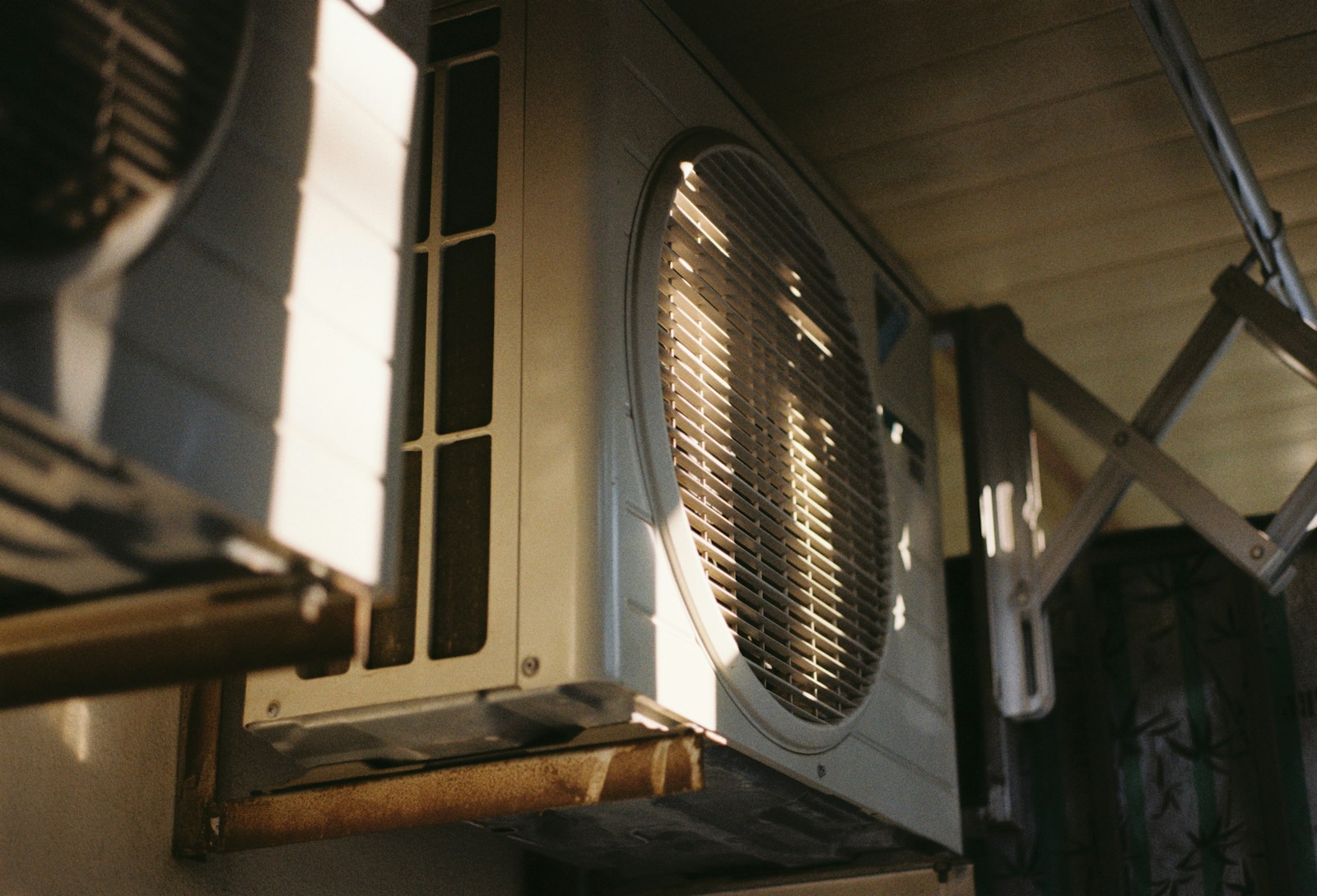 Close-up of an air conditioning unit on a sunny day.